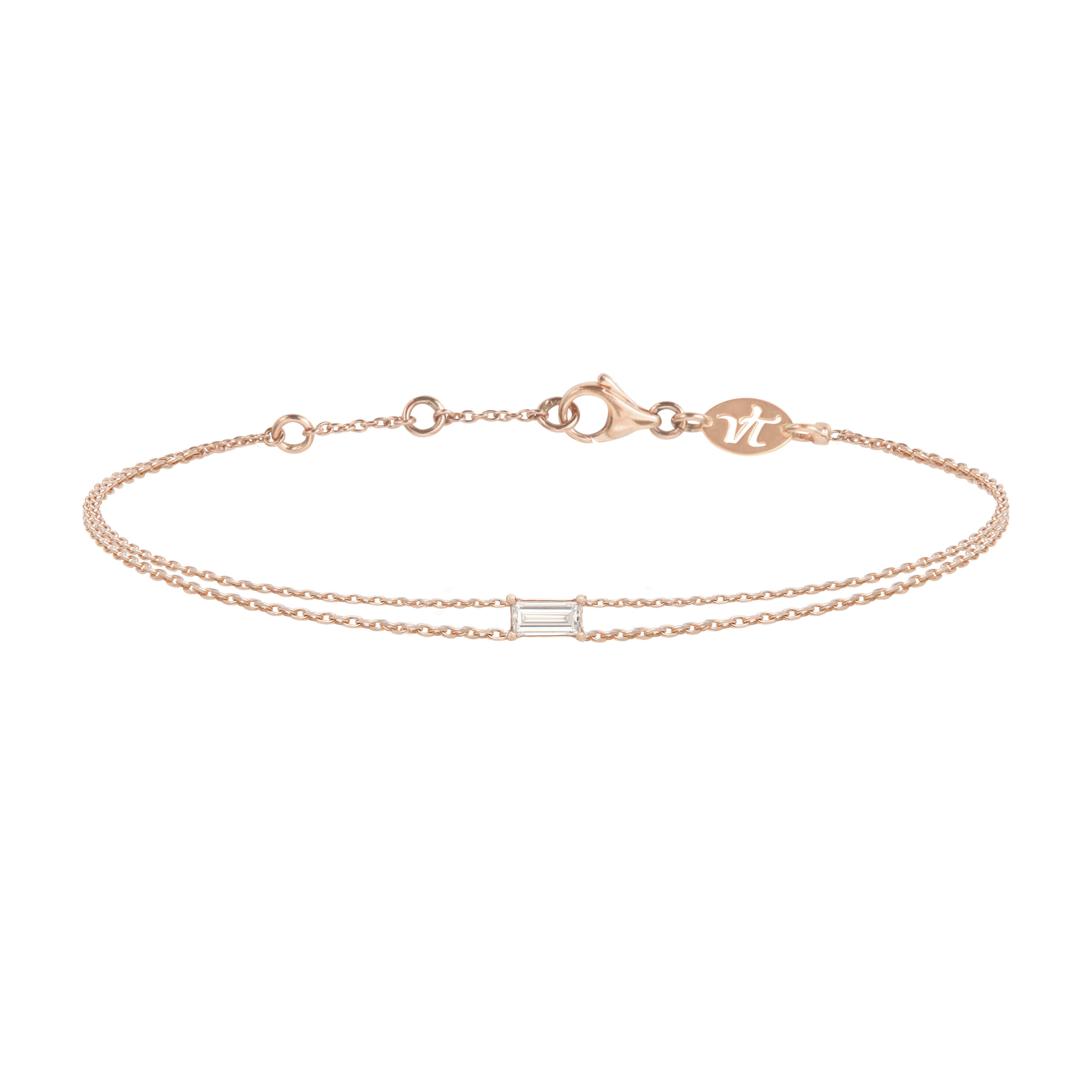 Bracelet double chainette en or rose et diamant baguette pour femme, à superposer ou à accumuler. Ce bijou de joaillerie fine fabriqué en France est prisé par les stars et célébrités et est idéal en cadeau d'anniversaire, d'amitié ou d'amour.