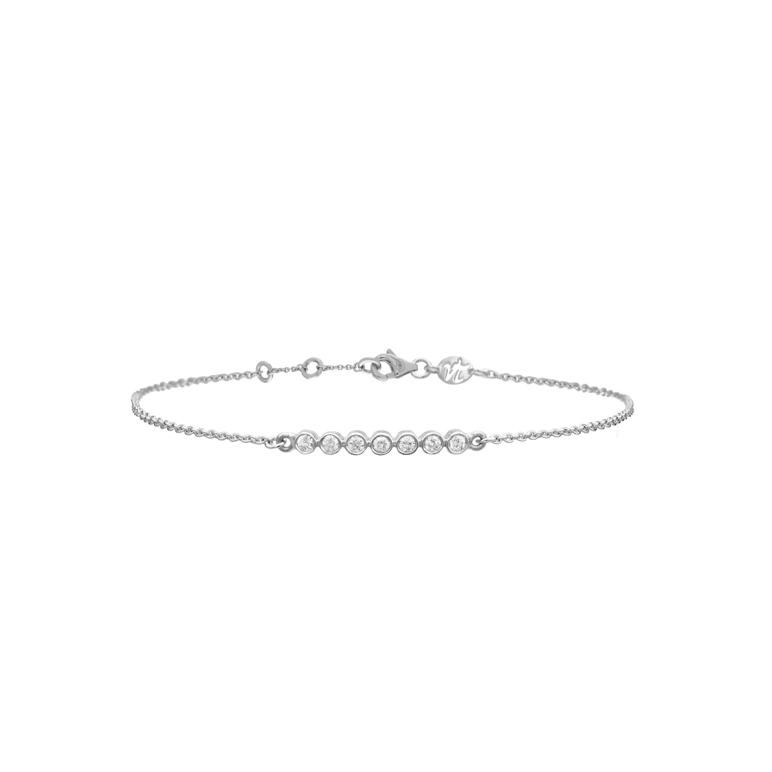 Bracelet tendance en or blanc et diamants pour femme, à superposer ou à accumuler. Ce bijou de joaillerie fine fabriqué en France est prisé par les stars et célébrités et est idéal en cadeau d'anniversaire, d'amitié ou d'amour.